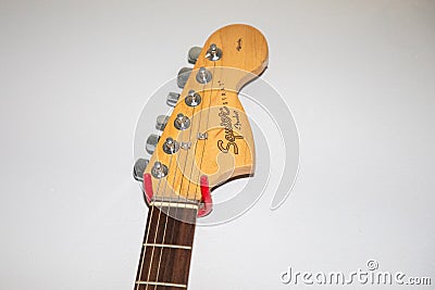 Fender squier strat Guitar brand logo and text sign electric guitar head detail Editorial Stock Photo