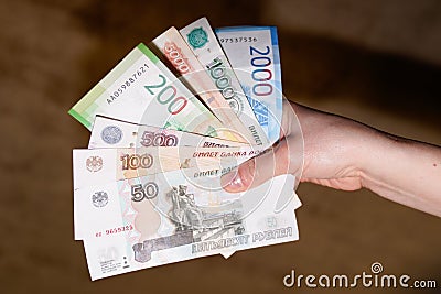 Hand holding flat money russian ruble banknotes currency cash paper note business and Editorial Stock Photo