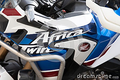 Honda Africa Twin brand sign and text logo on fuel tank motorcycle motor bike in Editorial Stock Photo