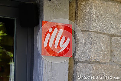 Illy coffee shop red sign brand and text logo cafe Italian coffee makers in wall Editorial Stock Photo