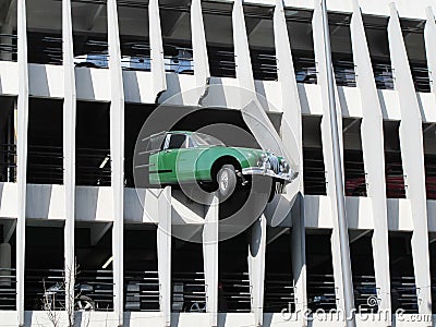 Bordeaux , Aquitaine / France - 10 02 2019 : Jaguar automobile vintage crosses the wall of the car park in Bordeaux city Editorial Stock Photo