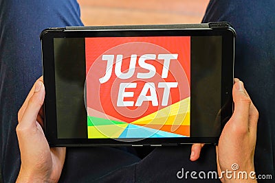 Bordeaux , Aquitaine / France - 03 03 2020 : just Eat sign logo tablet home application food delivery app Editorial Stock Photo