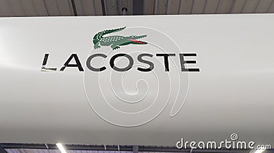 Lacoste brand logo in interior mall shop sign text on store front boutique Editorial Stock Photo