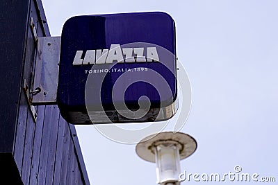Lavazza logo brand and text sign on wall coffee shop advertising facade pub bar Editorial Stock Photo