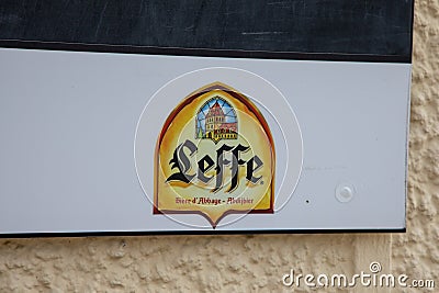 Leffe Belgian beer sign logo and brand text on wall entrance bar restaurant facade Editorial Stock Photo
