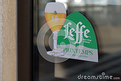 Leffe Belgian beer sign sticker with text logo on windows bar restaurant pub Editorial Stock Photo