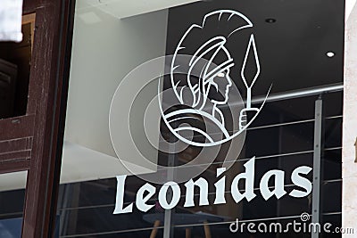 Leonidas logo brand and sign text wall windows facade shop entrance of Belgian Editorial Stock Photo