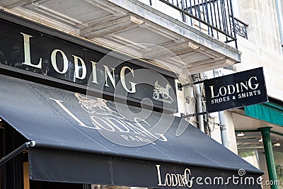 loding brand text facade store entrance signage and logo sign on shop wall facade Editorial Stock Photo