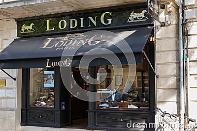 Loding paris logo and tex sign front of boutique store Shoes & shirts shop men and Editorial Stock Photo