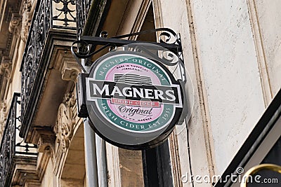 Magners Irish Cider logo and text sign advertising on wall pub bar restaurant Editorial Stock Photo