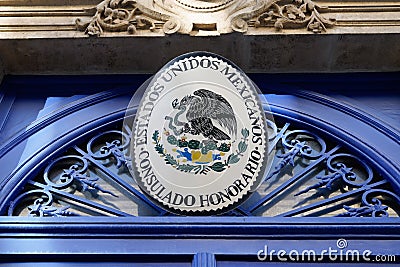 Mexicanos estados unidos board text consulado honorario front of building facade of Editorial Stock Photo