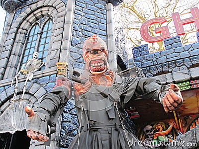 Bordeaux , Aquitaine / France - 11 19 2019 : monster in front of medieval tower of a fairground ghost train with skeleton in Editorial Stock Photo