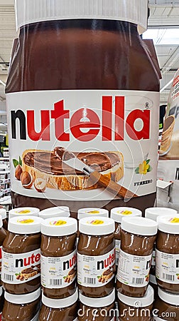 Nutella chocolate hazelnut spread with cocoa nuts on display advertising giant in Editorial Stock Photo