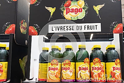 Pago fruit juice soda lemonade logo sign and brand text on bottles shelf of Editorial Stock Photo