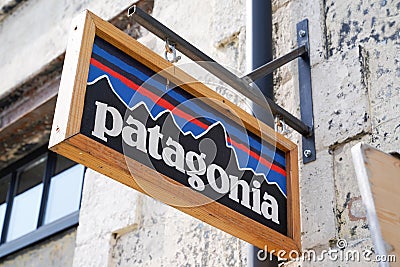 Patagonia logo brand and text sign on facade shop fashion clothes entrance store Editorial Stock Photo
