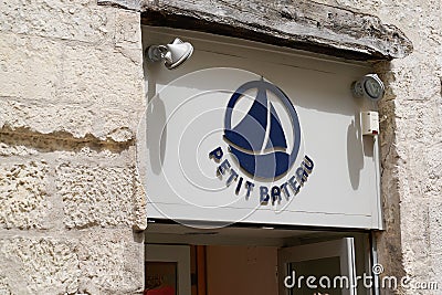 Petit Bateau logo and sign front of kids fashion store of Small boat shop for Editorial Stock Photo