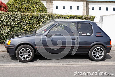 Peugeot 205 gti old timer retro ancient sport vintage car french in street Editorial Stock Photo