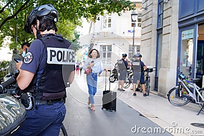 Policeman with text sign and symbol logo of French national police in city street Editorial Stock Photo