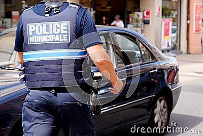Policeman text sign walking man French national police in city street Editorial Stock Photo