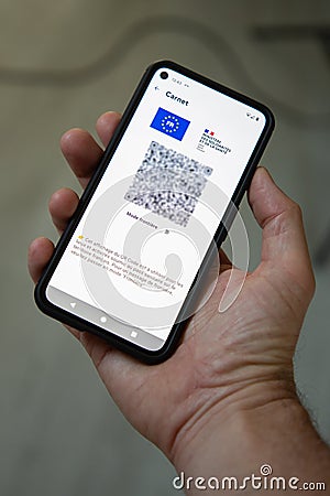 Sanitary pass screen cell phone qr code sign on smartphone with the validation of the Editorial Stock Photo