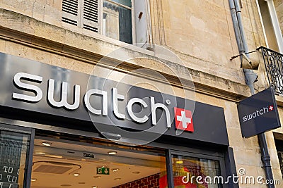 Swatch logo brand and text sign store swiss fun watch manufacturing watches shop Editorial Stock Photo
