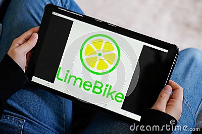 Bordeaux , Aquitaine / France - 11 25 2019 : tablet hand logo of LIME app rent bike e-Scooter rental electric scooter company Editorial Stock Photo