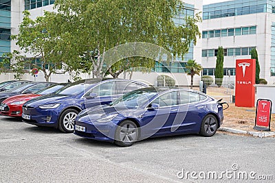 Tesla Model 3 and x blue electric car vehicle in dealership new cars sale ready for Editorial Stock Photo