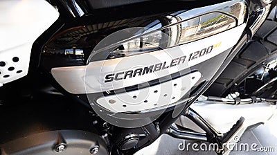 Triumph logo brand and text sign scrambler motorcycle detail fuel tank on motorbike Editorial Stock Photo