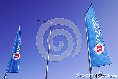 U location sign logo and text brand on flag of van rental trucks city rent car chain Editorial Stock Photo
