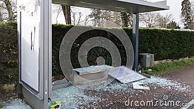 vandalized bus stop with broken windows by protesters extreme demonstrators Editorial Stock Photo
