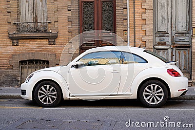 Vw beetle new volkswagen white car parked in the street Editorial Stock Photo