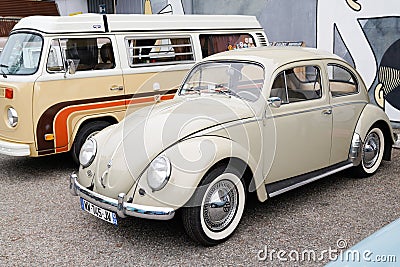 Vw Volkswagen old Beetle ancient vintage car parked front bus westfalia type 2 camper Editorial Stock Photo