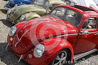 Vw Volkswagen red Beetle ancient vintage car line bug in show exhibition outdoor Editorial Stock Photo