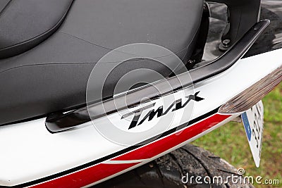 Yamaha t-MAX logo brand and text sign on scooter side panel detail with handlebars and Editorial Stock Photo