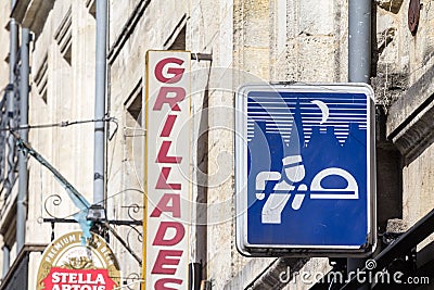 Logo of a french baker, an artisan boulanger, in front of a typical french craft bakery, a boulangerie Editorial Stock Photo