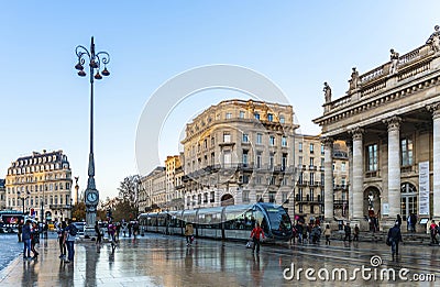 Tram arriving at Place de la ComÃ©die, in front of the Grand Theater de Bordeaux in Gironde, Nouvelle Aquitaine, France Editorial Stock Photo