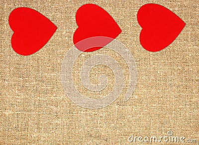 Border frame of red hearts on sack canvas burlap background Stock Photo