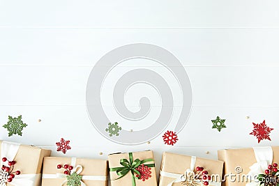 Border of gift boxes wrapped in kraft paper on white wood desk background Stock Photo