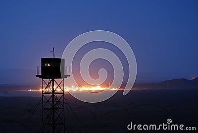 Border guard tower at night Stock Photo