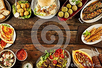 Border of Mediterranean dishes and bread on table Stock Photo
