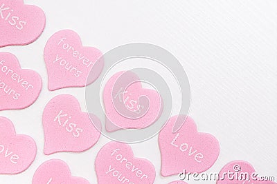 Border pink hearts with text LOVE, KISS, FOREVER YOURS on white background with copy space. Valentines day concept. Gift for lover Stock Photo