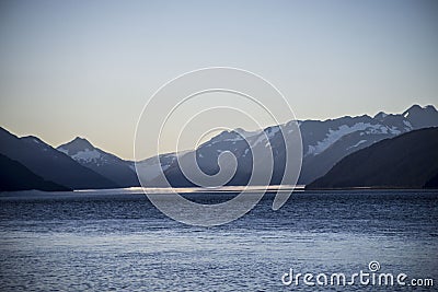 The bore tide rolling into the bay of Seward Bay. Stock Photo