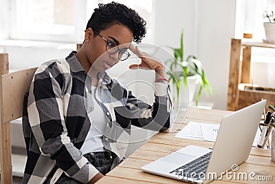 Bored african american woman tired from computer work or study Stock Photo