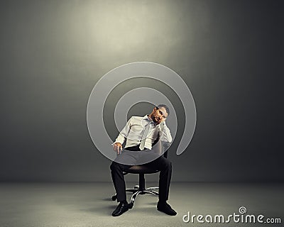 Bored businessman sitting in the room Stock Photo
