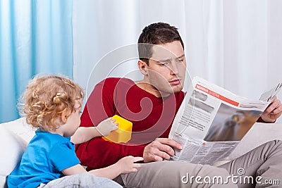 Bored child looking at father Stock Photo