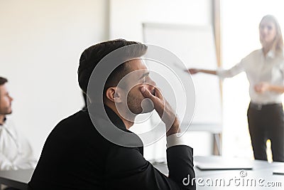 Bored employee fall asleep during seminar or presentation in office Stock Photo