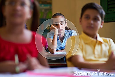 Bored Female Student Latina Girl In Class At School Stock Photo