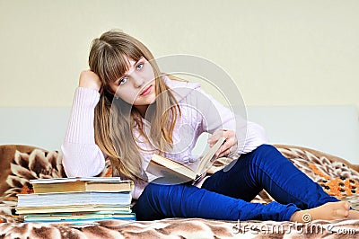 Bored girl with books Stock Photo