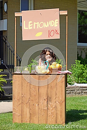 Bored girl at lemonade stand Stock Photo