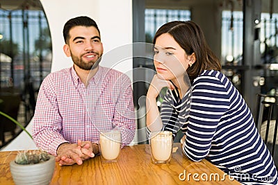 Bored girlfriend on a dull date Stock Photo